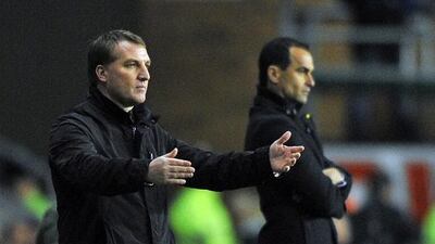 Brendan Rodgers, left, and Roberto Martinez are both young and have similar footballing philosophies. Paul Ellis / AFP