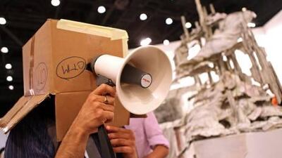 Abhishek Hazra, 33 of Bangalore, India, leads an unusual tour of the exhibitions for art enthusiasts at Art Dubai in Madinat Jumeirah. Amy Leang / The National