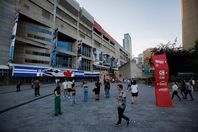 Fans stand outside the Rogers Centre after The Weeknd's Toronto show was postponed amid telecommunication company Rogers's service trouble. AP