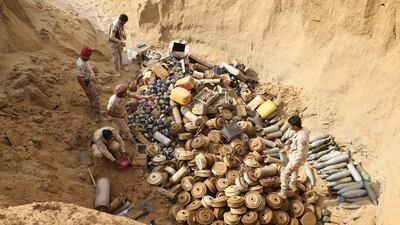 A joint Saudi-backed Sudanese-Yemeni force removes landmines, which they said were planted by the Iran-aligned Houthi rebels in Yemen's northern coastal town of Midi, in the Hajjah governorate. AFP