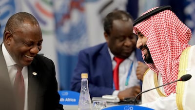 South Africa's President Cyril Ramaphosa, left, and Saudi Arabia's Crown Prince Mohammed bin Salman, smile at the start of the G20 summit in Buenos Aires, Argentina. AP Photo / Natacha Pisarenko