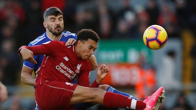 Liverpool's Trent Alexander-Arnold in action with Cardiff City's Callum Paterson. Reuters