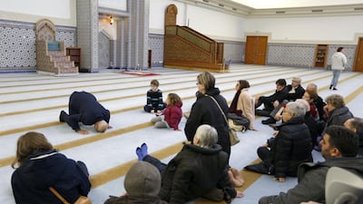 People listen to the explanations of guide Mohamed Latahi as they visit the Strasbourg Grand Mosque on January 9, 2015, during a two-day open-house event for mosques in France. Vincent Kessler/Reuters
