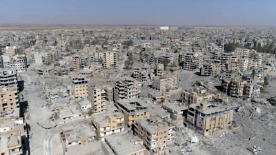 A frame grab made from drone video shows damaged buildings in Raqqa, Syria. AP. File