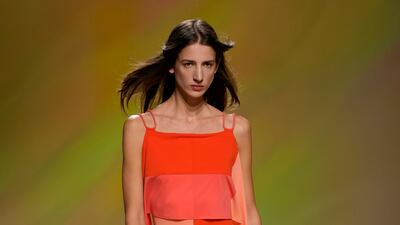 A chiffon dress in blocks of orange, peach and tangerine at Hermes ready-to-wear spring/summer 2023. AP