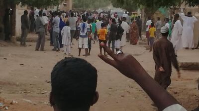 A Sudanese protester gestures during an anti-government demonstration in Khartoum on February 15, 2019. AFP