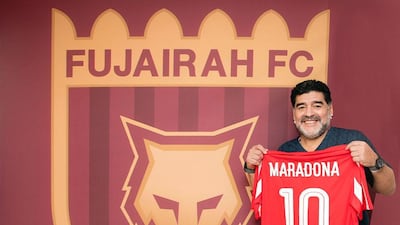 Football legend Diego Maradona poses alongside the Fujairah FC logo designed by Ms Al Kendi Fujairah Football Club. Courtesy Fujairah Football Club