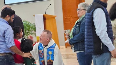 Parishioners at Dubai’s Christ Church queue up to speak to the parish priest. Photo: Christ Church Jebel Ali