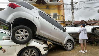 Damaged cars after flooding caused by Typhoon Kalmaegi in Cebu city, central Philippines. AP