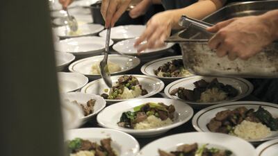 Chefs put the finishing touches on meals, credit Peter Yeung.jpg