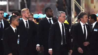 Leicester City's Kasper Schmeichel, team captain Wes Morgan, director of football Jon Rudkin, and manager Claude Puel arrive at Wat Thepsirin Buddhist temple. AFP