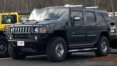 Hummers gathered in a car park.