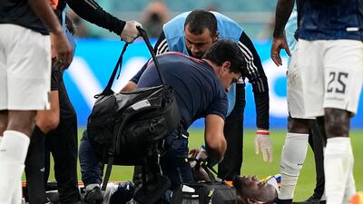 Enner Valencia lies injured on the pitch. AP