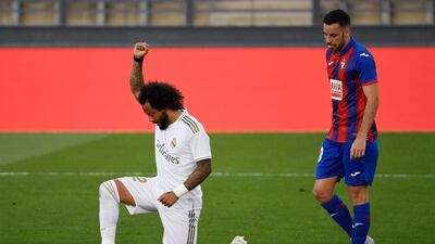 Real Madrid's Brazilian defender Marcelo kneels to celebrate his goal during the Spanish League match between Real Madrid and Eibar at the Alfredo di Stefano stadium in Valdebebas, on the outskirts of Madrid. AFP