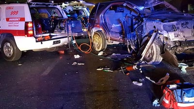 A woman had to be cut free from her car by rescue teams after driving into a street light in Al Quoz. Courtesy Dubai Police
