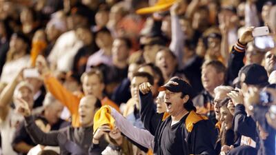 Steve Perry, former lead singer for the band Journey sings with crowd during the seventh inning of Game 5 of the National League baseball championship series against the St. Louis Cardinals Thursday, Oct. 16, 2014, in San Francisco. AP Photo/Ben Margot