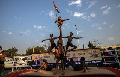 Indian students practice Mallakhambh, a traditional sport, on the stage prepared for the roadshow for US President Donald Trump in Ahmedabad, India. EPA