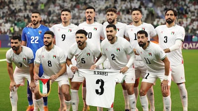 Palestine players before the start of the match in Qatar. Reuters