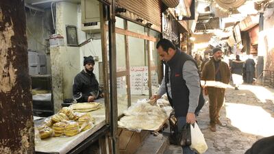 Syrians shopping for their basic daily needs at one on the traditional markets in Damascus. EPA