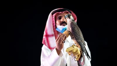 A Saudi man displays a falcon that was sold for $173,000 at an auction organised by the Saudi Falcon Club at the King Abdulaziz Festival in Mulham, north of Riyadh. Reuters