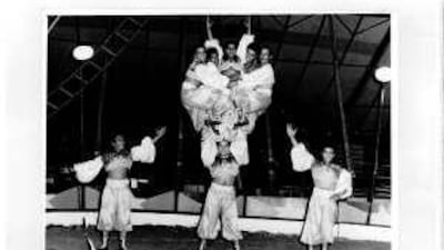 Ali Hassani, holding the human pyramid, became a circus tumbler after being snatched from a Moroccan marketplace at age seven.
