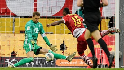 Bayern goalkeeper Manuel Neuer saves from Cologne's Jhon Cordoba. AP