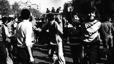 A crowd in Tehran celebrates as members of the army leave the city in government vehicles on February 11, 1979, the day that victory was officially announced in the Iranian Revolution. Kaveh Kazemi / Getty Images