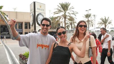 Race fans arrive on championship day behind the Pit Lane Walk at the Yas Marina Circuit in Abu Dhabi. Victor Besa / The National