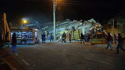 Turkish officials and police work at the scene of a collapsed building following a 6.8 magnitude earthquake in Elazig, eastern Turkey. AFP