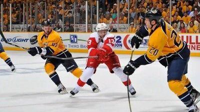 Ryan Suter of the Nashville Predators passes past Pavel Datsyuk of the Detroit Red Wings. Frederick Breedon /Getty Images