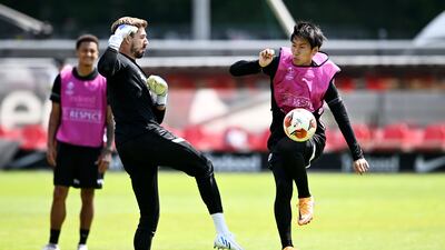 Kevin Trapp and Daichi Kamada of Eintracht Frankfurt during a training session at Deutsche Bank Park on Tuesday, May 17, 2022. Eintracht Frankfurt will face Rangers in the Europa League final on Wednesday. Getty