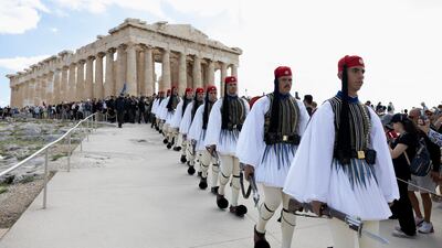 Presidential Guards in procession at the Parthenon in Athens after years of restoration work was completed. AP