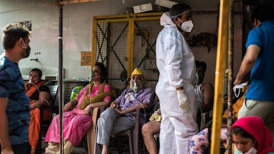 Patients suffering from Covid-19 are treated with free oxygen at a makeshift clinic outside the Shri Guru Singh Sabha Gurdwara in Indirapuram, Uttar Pradesh, India. Getty Images