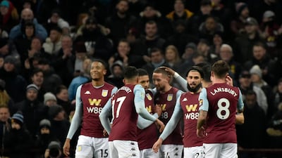 Aston Villa's Conor Hourihane, centrr, celebrates with teammates after scoring his side's opening goal. AP