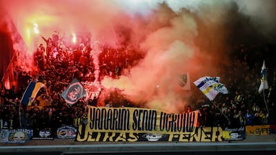 Fenerbahce fans set off flares during the Europa League soccer match against Anderlecht at the Constant Vanden Stock stadium. EPA