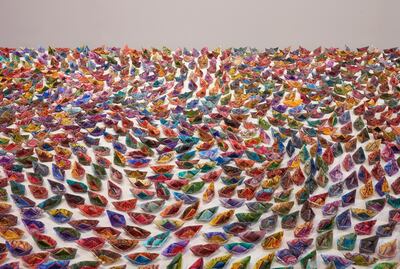 '1001 Migrations' is an installation by Mona Saeed Kamal, who created more than 1000 folded boats using paper hand-painted with floral patterns in beautiful jewel-like colours. Bric