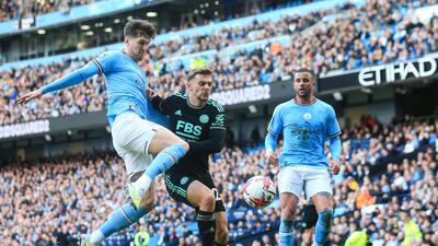 Manchester City's John Stones, left, fights for the ball with Leicester City's Kiernan Dewsbury-Hall. AFP