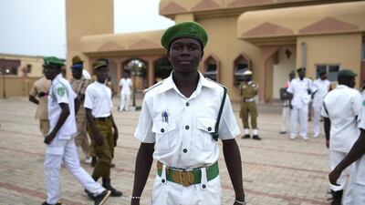 A volunteer poses for a photograph at the Grand Mosque after a daily Ramadan Tafsir session in Kaduna.