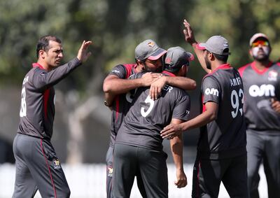 UAE captain Rohan Mustafa, left, took two Scotland wickets on Tuesday. Chris Whiteoak / The National
