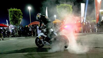 A rider performs stunts at the Abu Dhabi International Motor Bike Show. Satish Kumar/ The National
