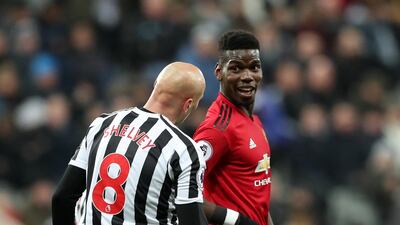 Manchester United's Paul Pogba shows his leg to Newcastle United's Jonjo Shelvey after a bad challenge. Reuters