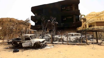 Burnt-out cars during clashes between the RSF and the army in Khartoum. Reuters