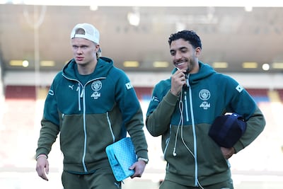 Erling Haaland, left, with Manchester City teammate Omar Marmoush. Haaland is carrying a Jouvence MM Toiletry Bag by Goyard. Getty Images