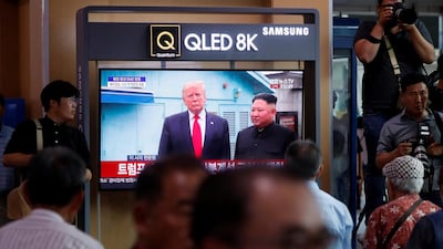 South Koreans watch a television broadcasting news of the event. EPA