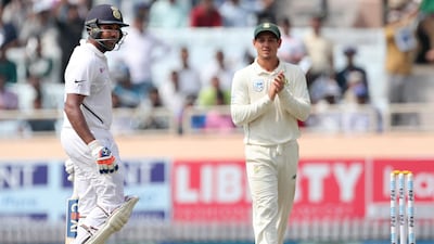 South Africa's Quinton de Kock applauds Rohit Sharma, left, on scoring a double century. AP