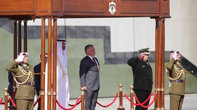 Sheikh Mohamed bin Zayed and King Abdullah listen to the national anthems before inspecting the Royal Guard of Honour. Andre Pain / EPA