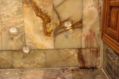 Bullet holes and blood in the Shah Cheragh shrine in Shiraz, Iran. Reuters