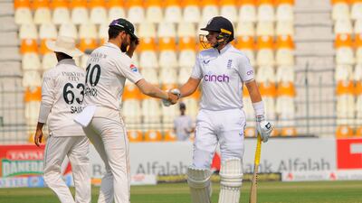 Pakistan bowler Shaheen Afridi congratulates England's Joe Root. EPA