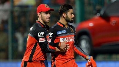 Virat Kohli, right, and AB De Villiers. AFP / MANJUNATH KIRAN