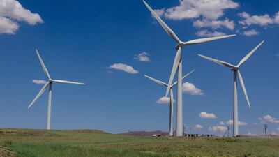 A group of wind generators in the steppes of Kazakhstan. Abu Dhabi's ADQ and Taqa have agreed with Kazakhstan's Samruk-Kazyna to explore the development of three greenfield power projects in the country. Photo: Alamy